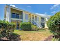 Inviting condo building with mature trees, and ample green space at 446 Cerromar Rd # 291, Venice, FL 34293