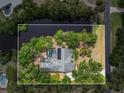 Overhead aerial view of home with a pool, waterfront and view of the neighborhood at 5282 Box Turtle Cir, Sarasota, FL 34232
