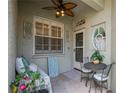 Cozy covered porch with seating and decor, a charming entry to the home at 5346 Neil Dr, St Petersburg, FL 33714