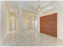 Spacious foyer with decorative tile flooring and high ceilings at 5533 Ashley Pkwy, Sarasota, FL 34241