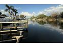 Waterway view showing waterfront property and boat docks on a sunny day at 7125 Westmoreland Dr, Sarasota, FL 34243