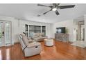 Inviting living room featuring hardwood floors, stylish furniture, neutral colors, and a cozy atmosphere at 801 E 5Th St, Englewood, FL 34223
