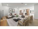 Bright and airy living room featuring modern decor and an open layout to the kitchen at 1052 Concord W Dr, Dunedin, FL 34698