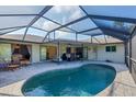 Screened-in pool and outdoor living area features an in-ground pool and brick-paver deck for backyard enjoyment at 1104 76Th Nw St, Bradenton, FL 34209