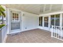 Inviting outdoor patio featuring tiled flooring and access to the home's interior at 1404 44Th E Ave, Ellenton, FL 34222
