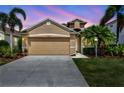Charming single-Gathering home with a two-car garage and lush landscaping at 14315 Tree Swallow Way, Lakewood Ranch, FL 34202