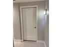 Unit 401 features a classic white apartment door with a stylish number plate and modern handle at 1500 State St # 401, Sarasota, FL 34236
