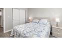 Cozy bedroom with marine-themed decor, spacious closet, and laminate wood flooring at 2008 Canal Dr # M3, Bradenton, FL 34207