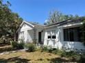 Charming single-story home with a well-maintained lawn, and a inviting porch with wrought iron accents at 4704 Winchester Dr, Sarasota, FL 34234