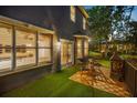Cozy outdoor seating area with turf, wood tile patio, and an inviting backyard space at 5716 Bayshore Blvd, Tampa, FL 33611