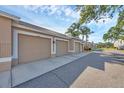 Attached garages for condo units featuring individual door numbers, set in a well-maintained community at 9560 High Gate Dr # 1622, Sarasota, FL 34238