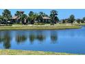 Picturesque pond with benches and landscaping providing a serene outdoor space at 141 Tierra Verde Way, Bradenton, FL 34212