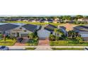 Serene water view homes; lush lawns, and brick driveways in a peaceful community at 14444 59Th E Cir, Bradenton, FL 34211