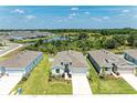 An aerial shot of the community showcasing the home's location with a scenic water view in the background at 16109 6Th E Ave, Bradenton, FL 34212