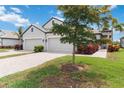 A charming single-story home boasting a well-manicured lawn and paver driveway at 17885 Cherished Loop, Bradenton, FL 34211