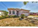 Lovely single-Gathering home with a manicured lawn and garden, a two-car garage, and a welcoming entrance at 1886 Vamo Dr, Sarasota, FL 34231