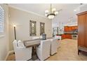 Elegant dining room featuring a stylish chandelier and comfortable seating at 2221 Bahia Vista St, Sarasota, FL 34239