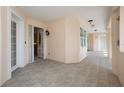 Welcoming hallway with neutral tile flooring and a glimpse of the unit's interior through an open doorway at 242 Hidden Bay Dr # 603, Osprey, FL 34229
