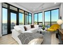 Bright living room featuring modern decor, floor to ceiling windows and city views at 33 S Palm Ave # 1602, Sarasota, FL 34236