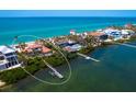 Aerial view of waterfront home with a private dock and ocean access at 3300 Casey Key Rd, Nokomis, FL 34275