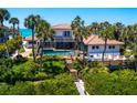Backyard oasis featuring a private pool, a deck, and lush tropical landscaping at 3300 Casey Key Rd, Nokomis, FL 34275