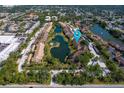 Aerial view showing multiple buildings and landscaping around community lakes at 5736 Ashton Lake Dr, Sarasota, FL 34231