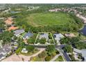 An aerial view of the property, showing the home and surrounding greenery at 8838 Bloomfield Blvd, Sarasota, FL 34238