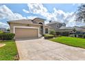 Lovely home featuring a well-manicured lawn and a welcoming two-car garage at 8995 Founders Cir, Palmetto, FL 34221