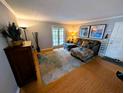 Bright living area featuring a large sectional sofa, modern rug, and sliding doors at 105 S Obrien St # 213, Tampa, FL 33609