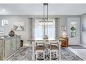 Bright dining area features stylish table with seating for four and decorative accents at 12291 Myrtle Bay Ct, Sarasota, FL 34238