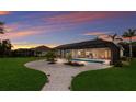 Well-manicured backyard leading to a screened-in pool and patio area, great for outdoor entertaining at 14210 9Th Ne Ter, Bradenton, FL 34212