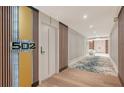 Modern hallway with contemporary design elements, decorative panels, and elegant lighting fixtures at 1701 Gulf Of Mexico Dr # 502, Longboat Key, FL 34228