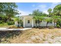 Charming home exterior with beautiful landscaping and curb appeal at 1709 Kerman St, North Port, FL 34288