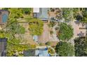 Birds eye view of the property, showing roof, driveway, mature trees, and outdoor living space at 1931 Bahia Vista St, Sarasota, FL 34239
