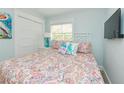 Bright bedroom features a comfortable queen-sized bed and ample natural light at 205 Elm Ave, Anna Maria, FL 34216