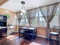 Breakfast nook bathed in natural light with modern table and bench seating near large windows at 21300 Brinson Ave # 214, Port Charlotte, FL 33952