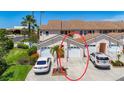 Close up view of the townhome, showing the roof, attached garage, and yard at 2609 Waterford Way # B, Palmetto, FL 34221