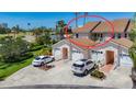 Exterior view of the townhome, showing the roof, attached garage, yard, and surrounding area at 2609 Waterford Way # B, Palmetto, FL 34221