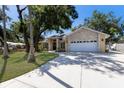 Charming single Gathering home with stone accents, double front doors and a lush green lawn at 3209 2Nd W Ave, Bradenton, FL 34205