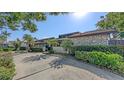 A well-maintained front yard with mature trees and manicured bushes, enhancing the property's charm and curb appeal at 3608 Avenida Madera, Bradenton, FL 34210