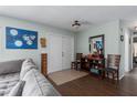 Inviting entryway featuring wood floors, decorative furniture, and light, neutral walls at 4403 5Th W Ave, Palmetto, FL 34221