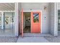 Inviting front door with a pop of color, leading into a bright and airy interior at 501 Key Royale Dr, Holmes Beach, FL 34217