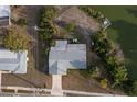 Aerial view of property including waterfront access, a private dock, and lounge chairs at 512 Shamrock Blvd, Venice, FL 34293