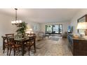 Open-concept living and dining area with sliding doors to lanai at 536 Lakeside Dr # 0, Bradenton, FL 34210
