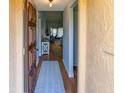 Inviting entryway with hardwood floors, a stylish rug, and a glimpse into the living space at 6218 29Th W Ave # 6218, Bradenton, FL 34209