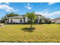 Beautiful single-Gathering home with an immaculate lawn and manicured landscaping on a sunny day at 6405 99Th E St, Bradenton, FL 34202