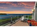 Enjoy breathtaking waterfront views from this relaxing deck with comfortable seating and a glass railing at 12 Tidy Island Blvd, Bradenton, FL 34210