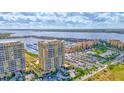 Beautiful aerial view showcasing the condos, marina, and waterfront location with lush landscaping and ample parking at 130 Riviera Dunes Way # 502, Palmetto, FL 34221