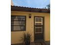 Welcoming entrance featuring a storm door, window and house number 1414 at 1414 58Th W St # 1414, Bradenton, FL 34209