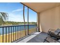 Relax on this large balcony overlooking a serene lake and scenic trees at 16804 Vardon Ter # 205, Bradenton, FL 34211
